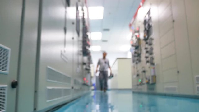 An engineer working in Electricity substation. Video Blurred style