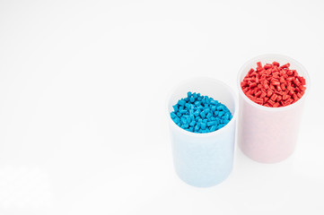 Plastic granules close up for holding,Colorful plastic granules with white background. and dollar money,Plastic Business,Plastic industry.