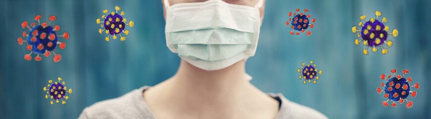 young woman in medical face protection mask indoors on blue background