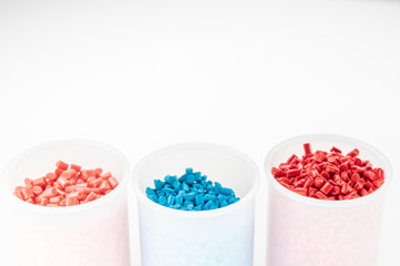 Plastic granules close up for holding,Colorful plastic granules with white background. and dollar money,Plastic Business,Plastic industry.