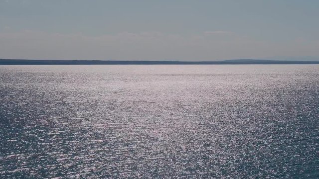 Beautiful sun glare on the surface of the sea