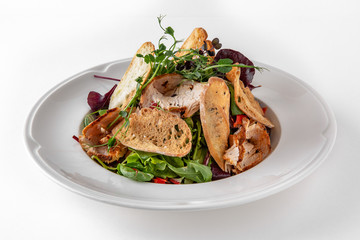 Salad of ham, prosciutto, pork or beef with vegetables, greens, berries and sauce. Nutritious, healthy dish. Banquet festive dishes. Gourmet restaurant menu. White background.