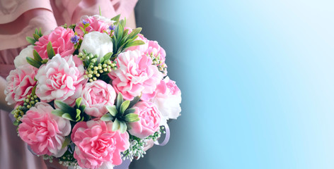 Beautiful bouquet of peonies on blue background. Mothers day, Womens day, Valentines day, birthday or wedding concept. Copyspace.