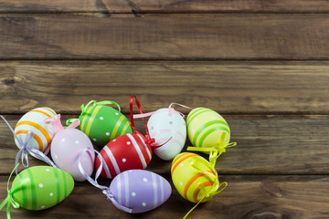 Fototapeta na wymiar Easter painted eggs on wooden background, copy spaсe 