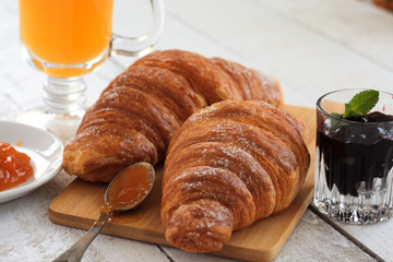 breakfast with croissant and orange juice