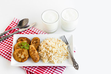 Traditional Turkish Vermicelli Rice or pilaff on the long plate with meatball.Served with cold,foamy buttermilk drink.