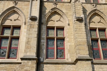 Stained glass windows on facade, Ghent, Belgium