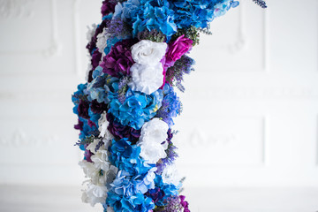 The lace flowers in the decor of the round swing .Design photo studio.