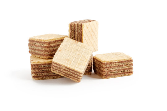 Heap of square wafer biscuits isolated on white background