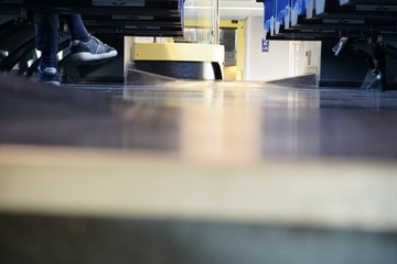 Scarcely occupied commuter train carriage in detail with two rows of seats empty due to coronavirus COVID-19 measures. Commuters are in home office or just under curfew.