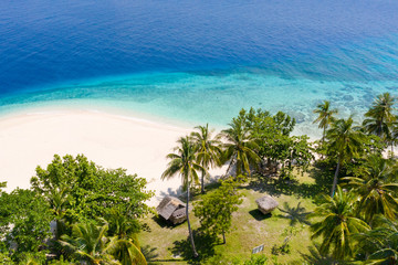 Obraz premium Tropical island with a beach and palm trees. Mahaba Island, Philippines.