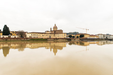 Beautiful Sights of Ponte Vecchio Bridge and Arno River in Florence, Italy.