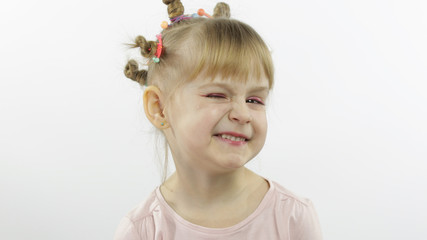 Positive girl emotionally make faces and winks in pink blouse. White background