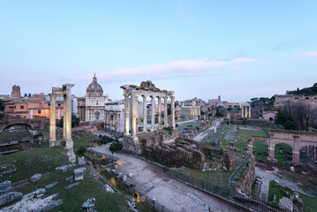 Fototapeta na wymiar Ruins of the Roman Forum at dusk in Rome, Italy