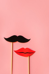 Photo booth props lips and Black Mustache isolated on pink background. © mayanko