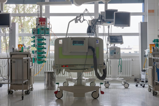  Intensive Care Unit In Hospital, Bed With Monitors, Ventilator, A Place Where Can Be  Treated Patients With Pneumonia Caused By Coronavirus Covid 19.