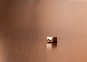 silver cufflinks for shirts on wooden background in all its detail.