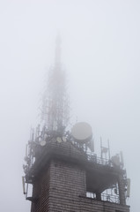 telecommunications tower in the fog
