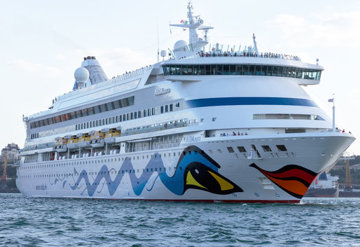ODESSA, UKRAINE- July 22, 2013: AIDAaura is the third ship operated by AIDA Cruises. Cruise ship AIDAaura red lips smile cruise came into the port of Odessa, Ukraine