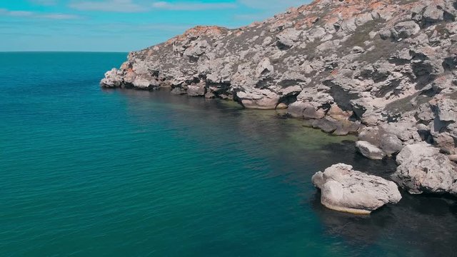 Flight near the huge rocks in the Crimea near the sea