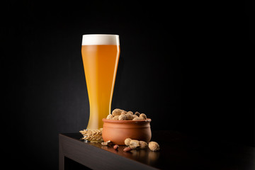 Cold unfiltered wheat beer and peanuts