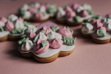 Cookies in a form of flowers. Spring concept. Candy bar. Birthday. Wedding. Pink background.