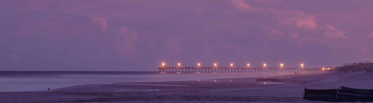 Kure Beach Pier At Sunset With A Pink Sky