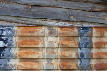 Sheet of old rusty metal with peeling paint, texture background