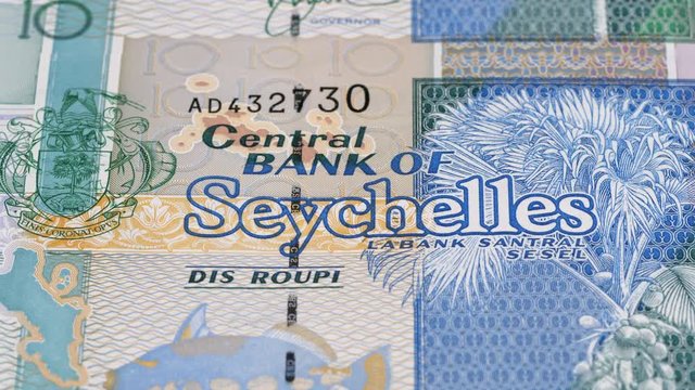 Seychelles rupee banknotes slow tracking. Seychellois currency. Slider shot, macro. Low angle, 4K