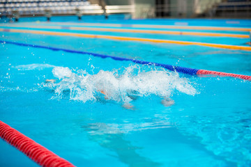 Water splash in swimming pool. Summer vacation holiday.