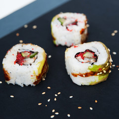 Japanese rolls on grey background.