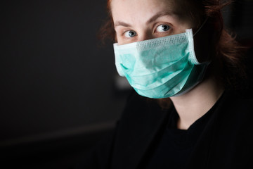 Business woman wearing a mask sitting in office, Concept, contagious disease, coronavirus.