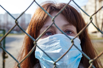 Woman wearing hygienic mask to prevent the Coronavirus.People in masks The outbreak of Novel Corona...