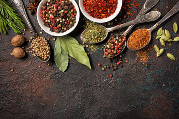 Different spices, dry kitchen herbs and seeds for tasty meals