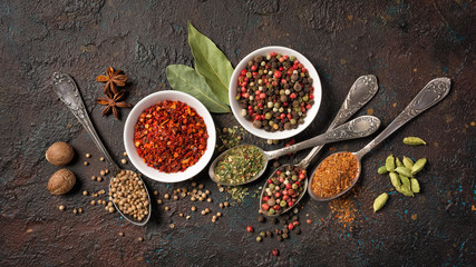 Different spices, dry kitchen herbs and seeds for tasty meals