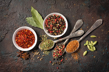 Different spices, dry kitchen herbs and seeds for tasty meals