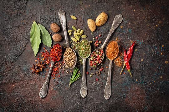 Different spices, dry kitchen herbs and seeds for tasty meals © viktoriya89