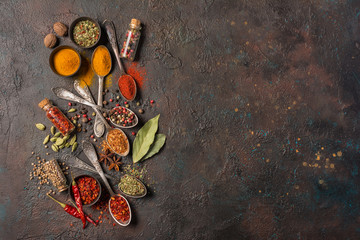Different spices, dry kitchen herbs and seeds for tasty meals