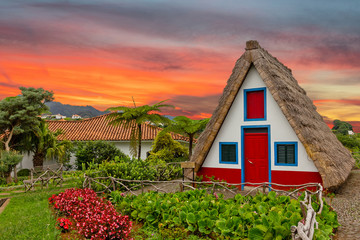 Madeira island rural traditional house sunset village landscape, Portugal, Santana - obrazy, fototapety, plakaty