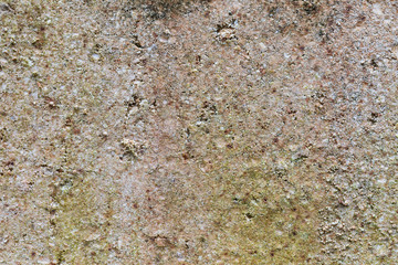 Part of the stone wall is moldy. Abstract background