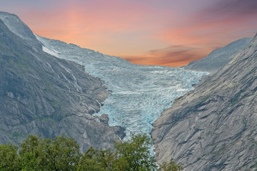 Obraz premium Glacier in National park Jostedalsbreen, mountain sunset landscape view, Norway