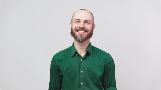 Portrait of a smiling handsome middle aged man over white background.