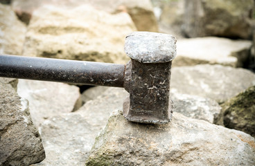 big hammer and stones close up