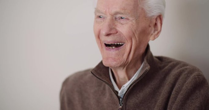 positive old man smiling and laughing