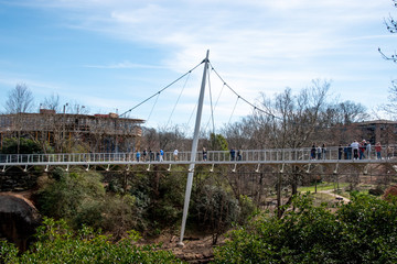 An side view of the Liberty Bridge spanning the Reedy River in Greenville, South Carolina