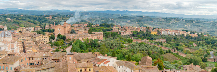Fototapeta na wymiar Panoramic wide banner of Old Town of medieval city of Siena