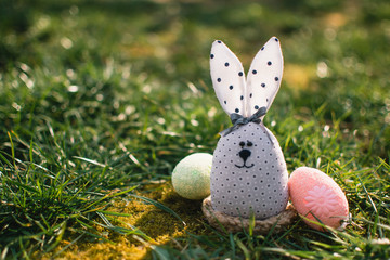 Little rabbit in green grass. Easter bunny. Easter holiday concept.