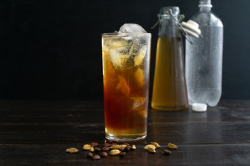 Fototapeta na wymiar Citrus Cardamom Coffee Spritzer: A mocktail made with coffee, lemon, and cardamom