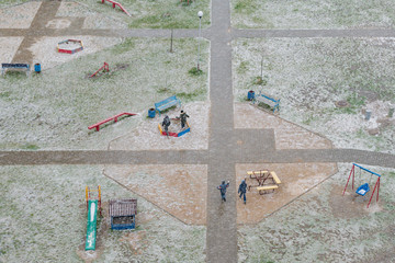 An empty Playground during a snowfall