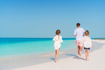 Happy beautiful family on a tropical beach vacation